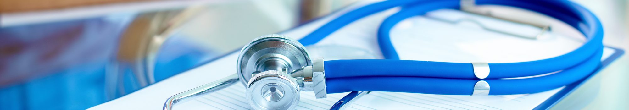 Close-up of stethoscope and paper.