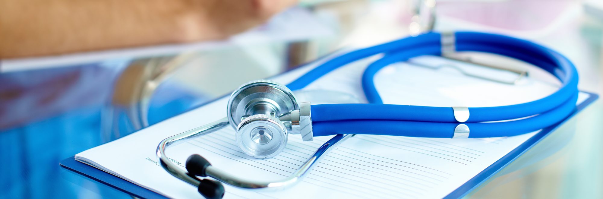 Close-up of stethoscope and paper.